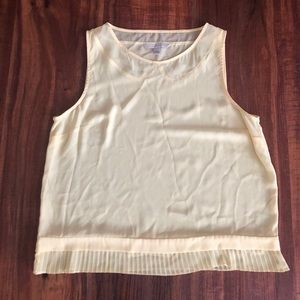 Pale yellow sheer sleeveless blouse
